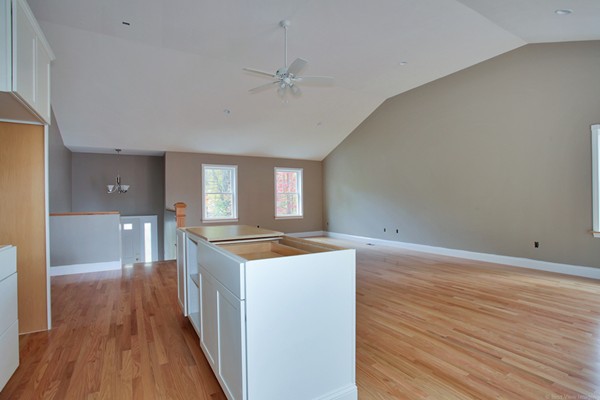 78 Groton Road Shirley, MA 01464 - Photo 10 of 30 a kitchen with wooden floor and cabinetry