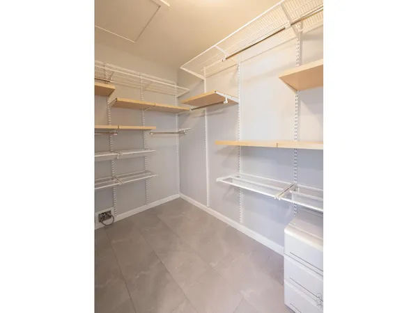 a view of an empty walk in closet