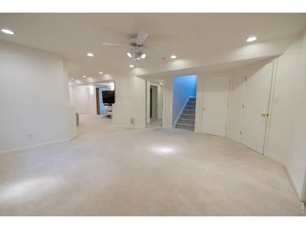 a view of a hallway with stairs