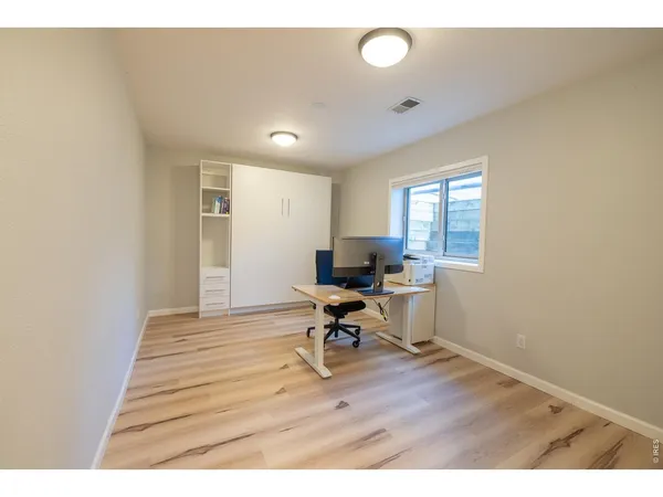 a workspace with furniture and a window