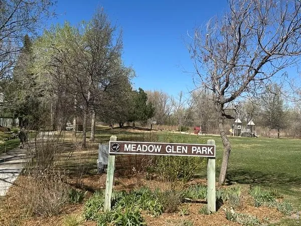 a view of a park with welcome board