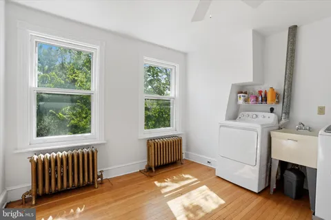a view of room with window and furniture