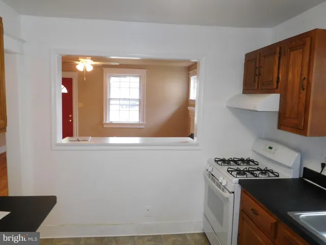 a kitchen with a stove and a refrigerator