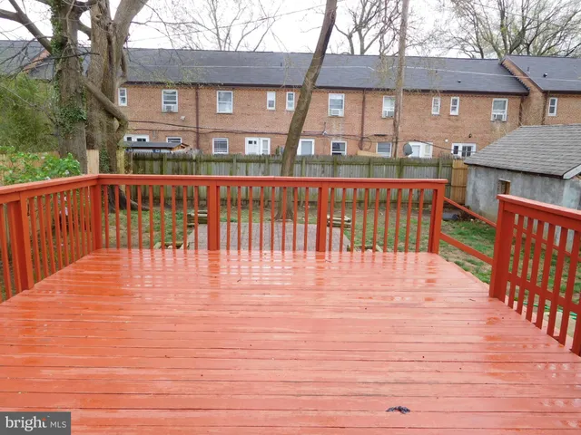 a view of a brick house with many windows