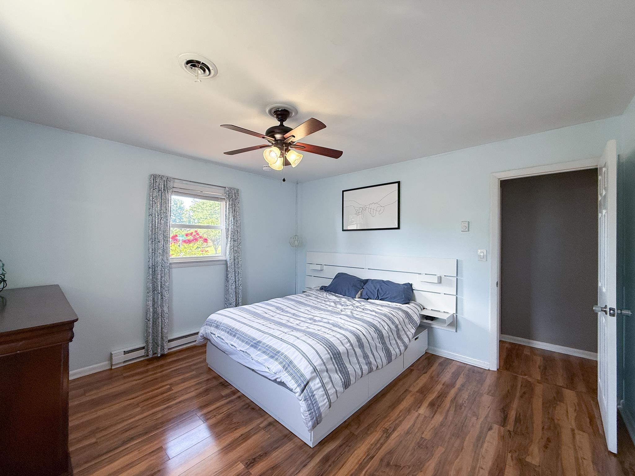 39 View Drive Stuarts Draft, VA 24477 - Photo 19 of 25 a bedroom with a bed and wooden floor