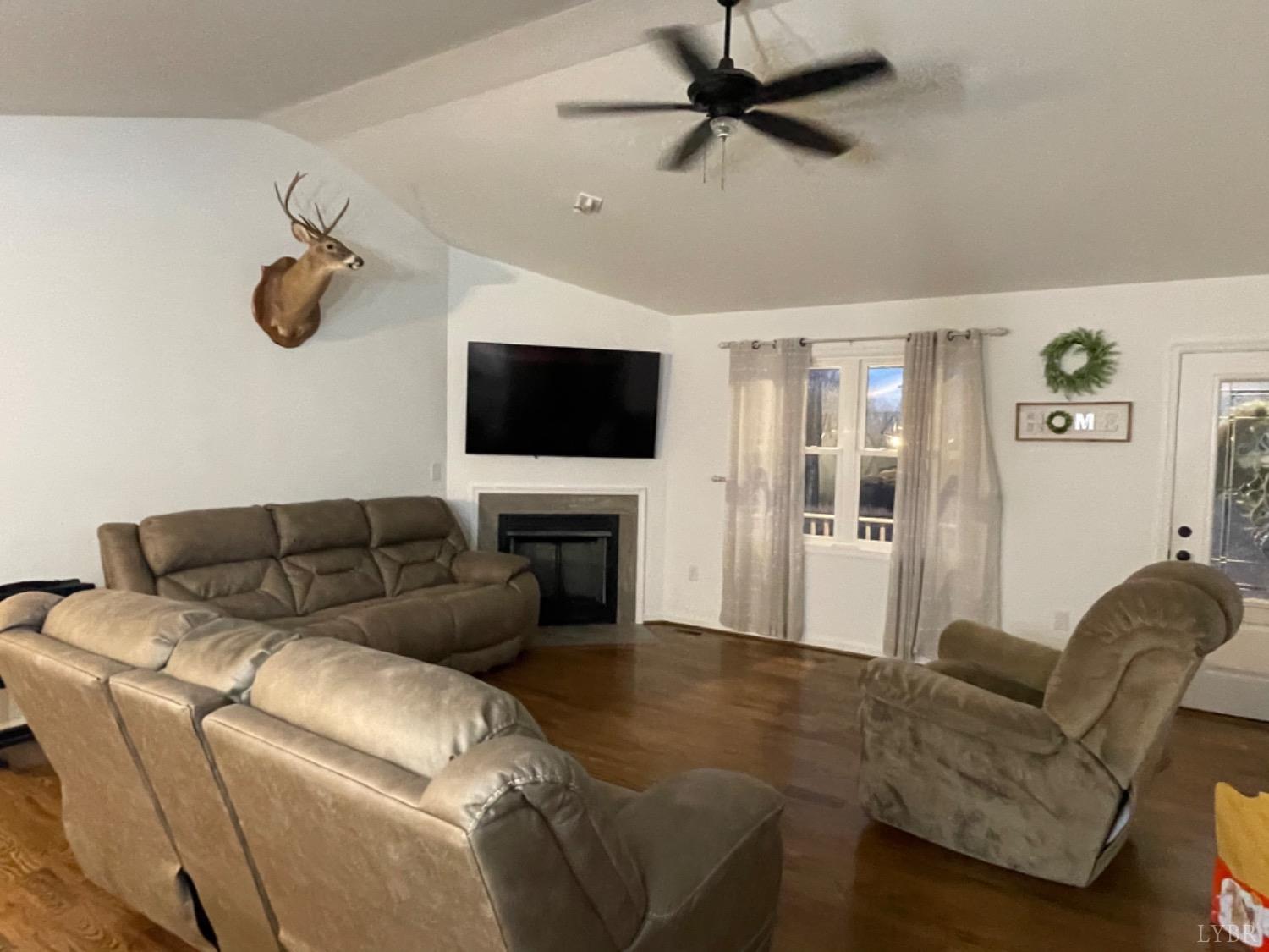 712 Columbus Road Concord, VA 24538 - Photo 11 of 34 a living room with furniture and a flat screen tv