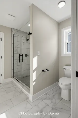 a spacious bathroom with a granite countertop sink a mirror and a