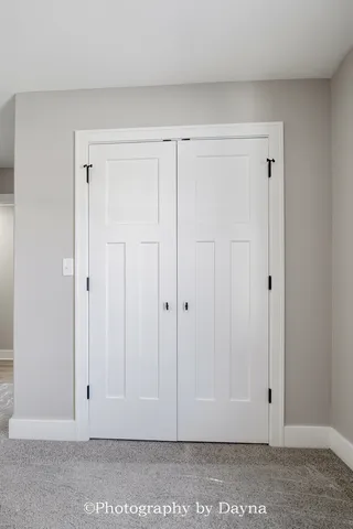 a view of room with wooden floor