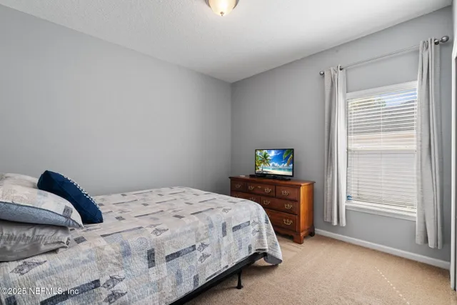 a view of a swimming pool and lounge chairs