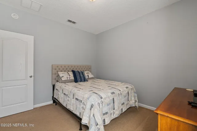 a view of a swimming pool with outdoor seating