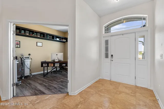 a bathroom with a granite countertop sink a mirror and a shower