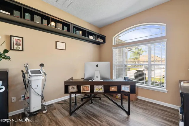 a dining room with furniture and window