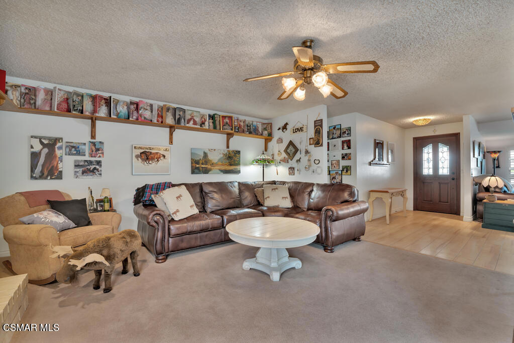 1278 Rambling Road Simi Valley, CA 93065 - Photo 13 of 76 a living room with furniture a chandelier