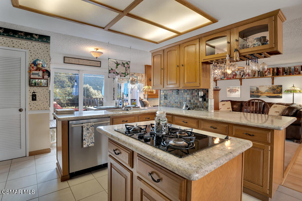 1278 Rambling Road Simi Valley, CA 93065 - Photo 16 of 76 a kitchen with stainless steel appliances granite countertop a sink stove and cabinets
