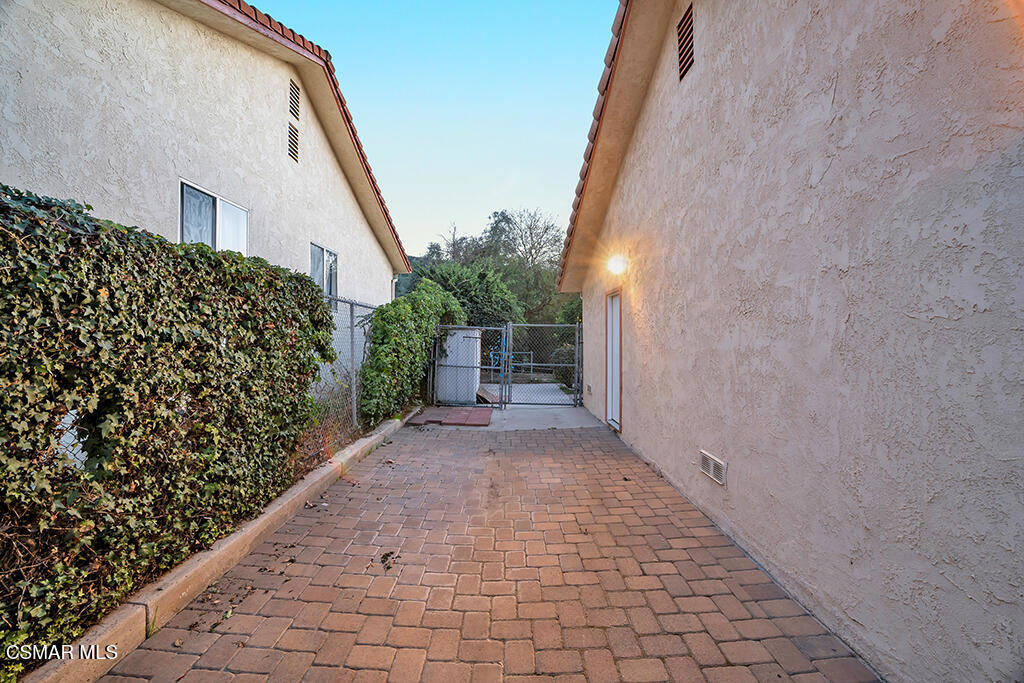 1278 Rambling Road Simi Valley, CA 93065 - Photo 47 of 76 a view of a pathway with a white house