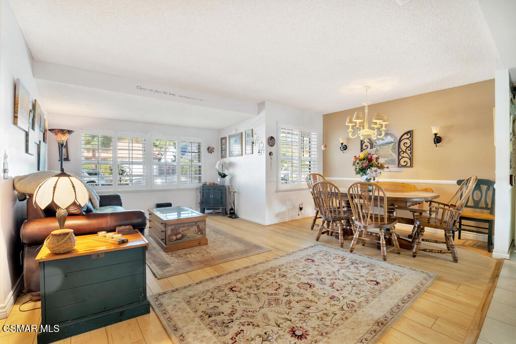 1278 Rambling Road Simi Valley, CA 93065 - Photo 5 of 76 a living room with furniture a rug and a dining table