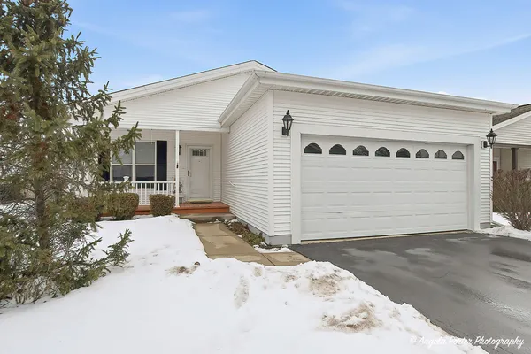 a view of a house with a snow in the yard