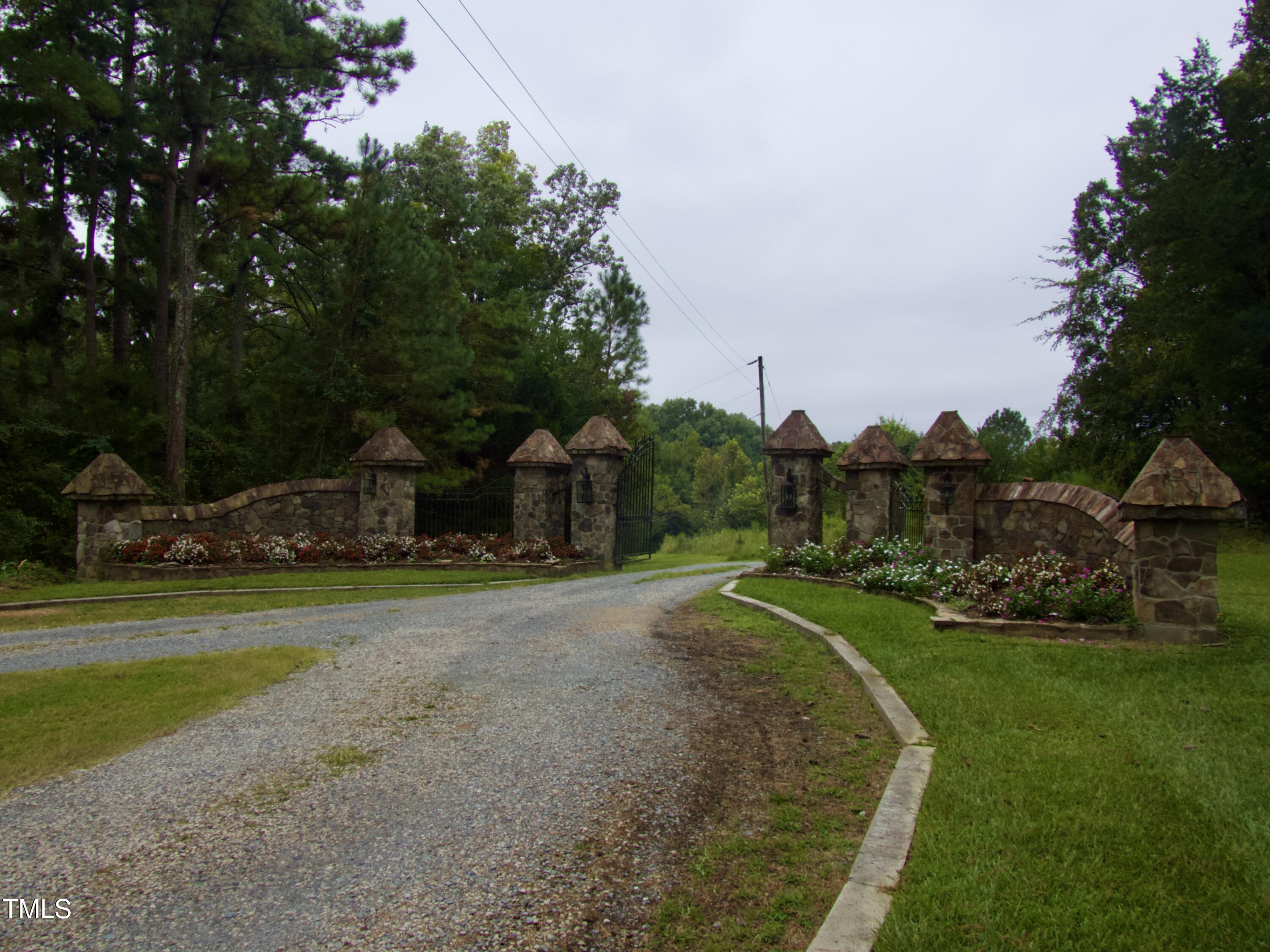 Tbd Tbd Walnut Springs Goldston, NC 27252 - Photo 26 of 28 a view of a house with a yard and basketball court
