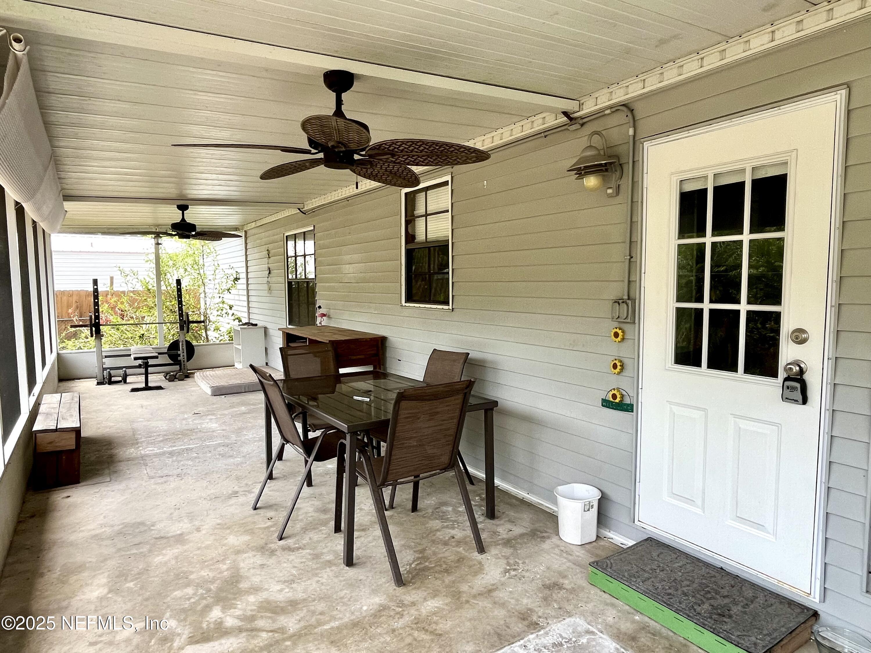 110 Mulberry Street Satsuma, FL 32189 - Photo 21 of 25 Screened back porch