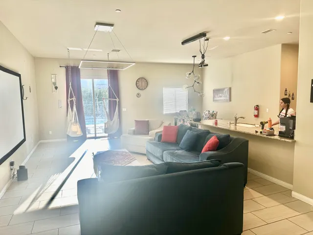 a living room with furniture and a large window