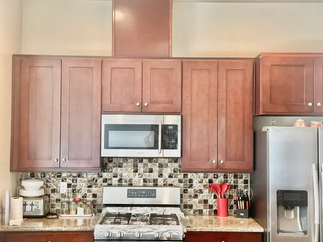 a living room with furniture and a dining table