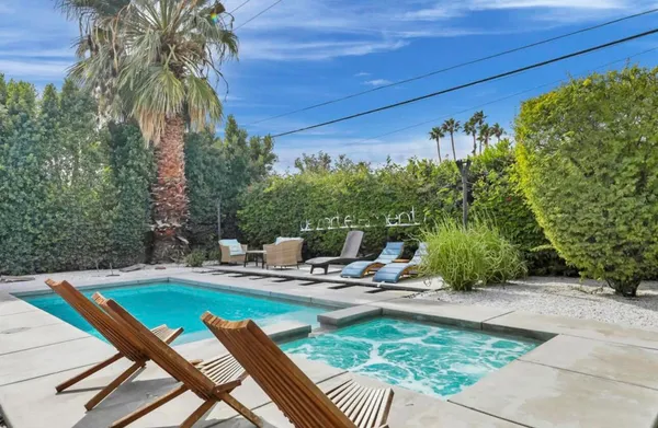 a view of a swimming pool with a patio