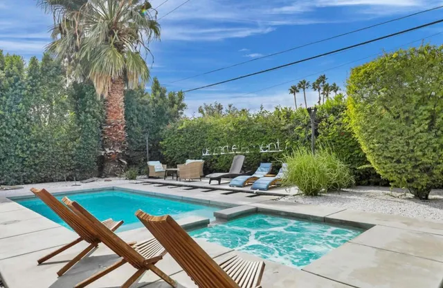 a view of a swimming pool with a patio