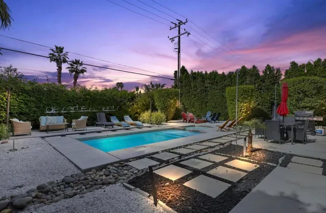 a view of a patio with a table and chairs