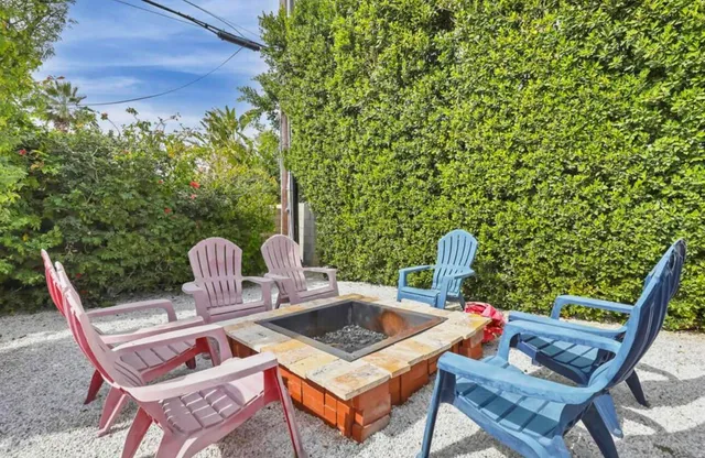 a view of a chairs and table in the patio