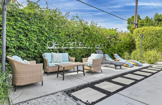 a view of a patio with couple of chairs