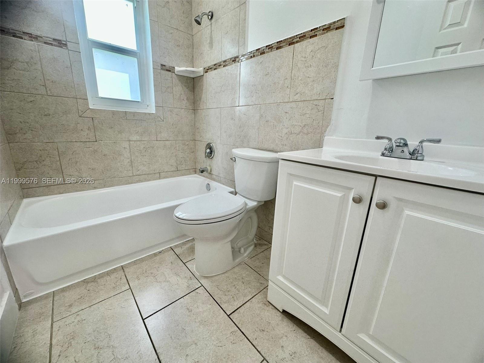 2014 Northwest 43rd Street Miami, FL 33142 - Photo 11 of 15 a bathroom with a sink a toilet and shower