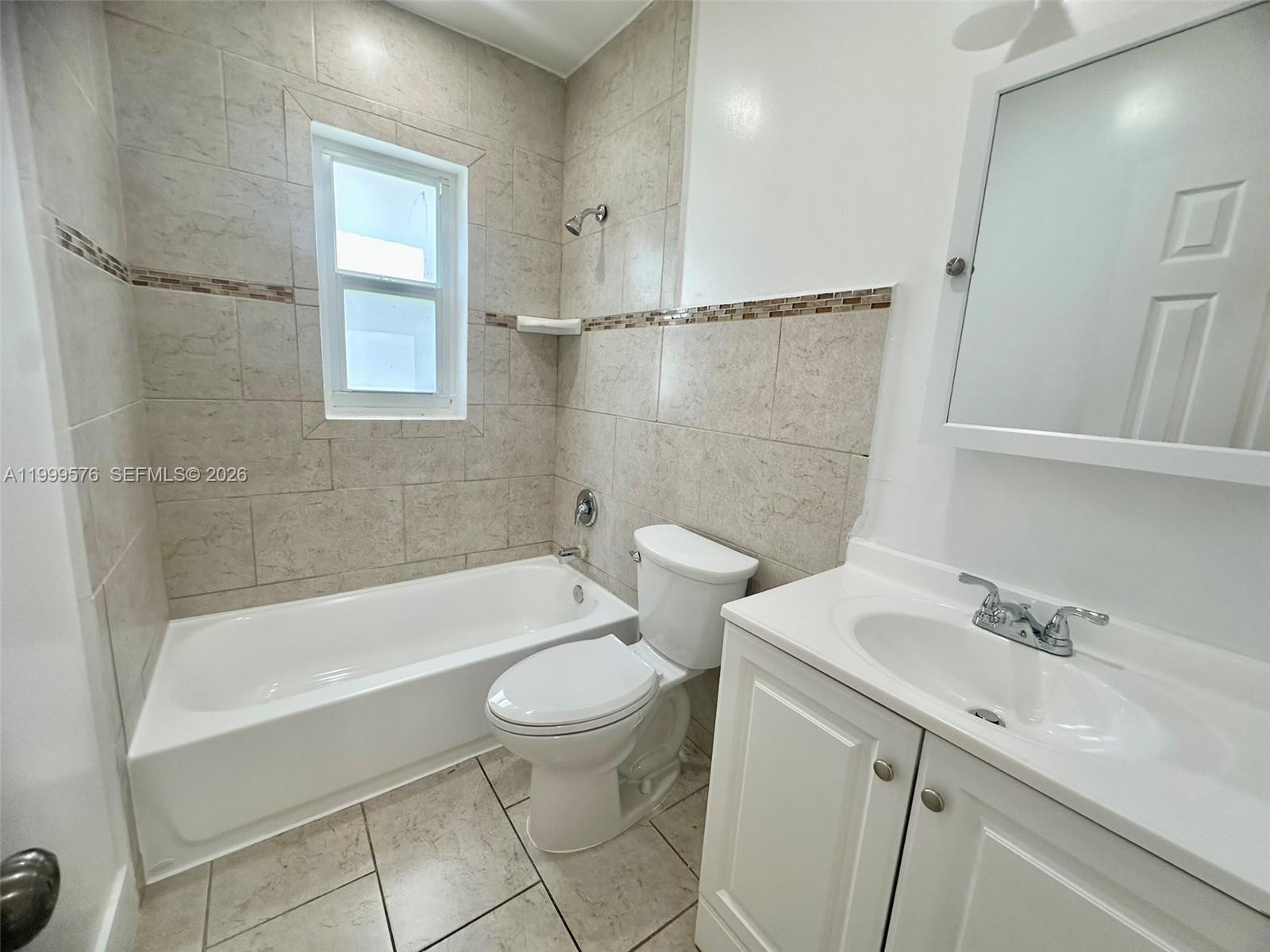 2014 Northwest 43rd Street Miami, FL 33142 - Photo 12 of 15 a bathroom with a sink toilet and shower