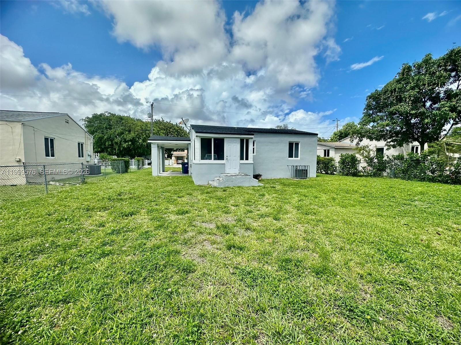 2014 Northwest 43rd Street Miami, FL 33142 - Photo 3 of 15 a house view with a garden space
