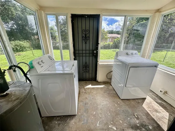 a view of washer and dryer with a mirror