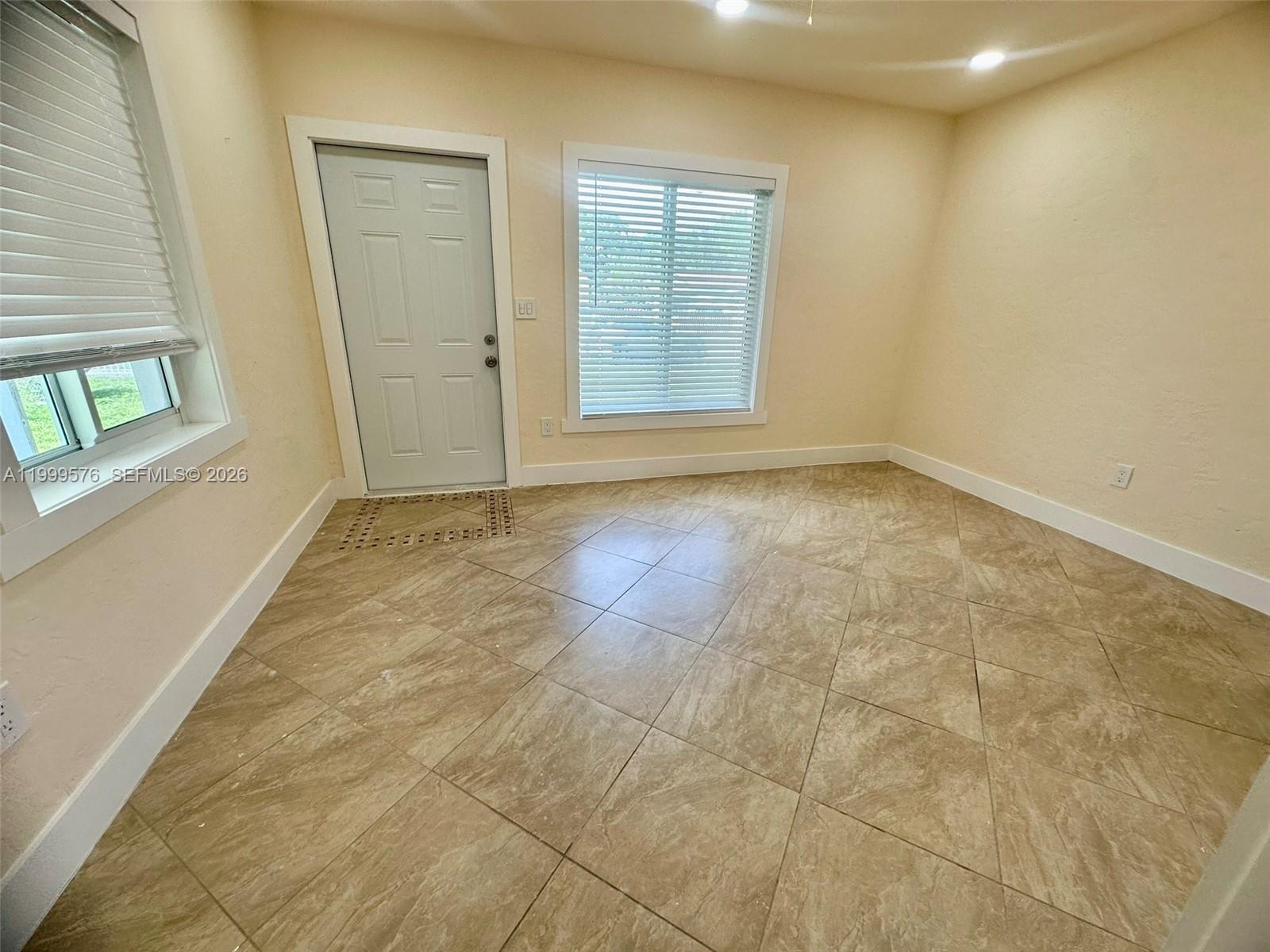 2014 Northwest 43rd Street Miami, FL 33142 - Photo 10 of 15 an empty room with windows