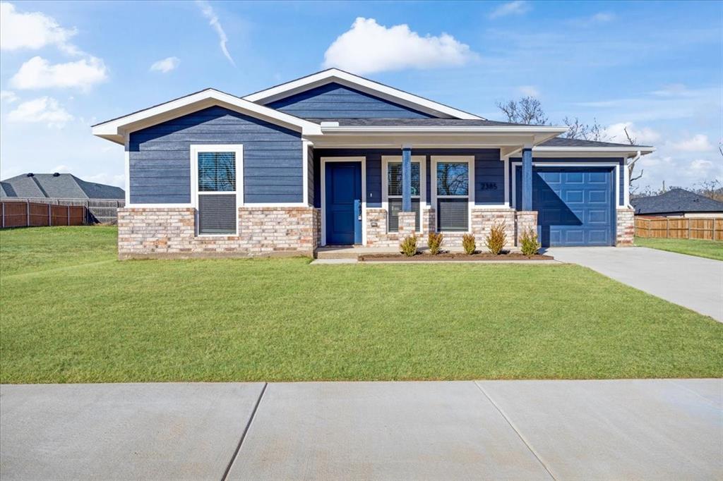 2385 Miller Street Denison, TX 75020 - Photo 1 of 26 a front view of a house with a yard and porch