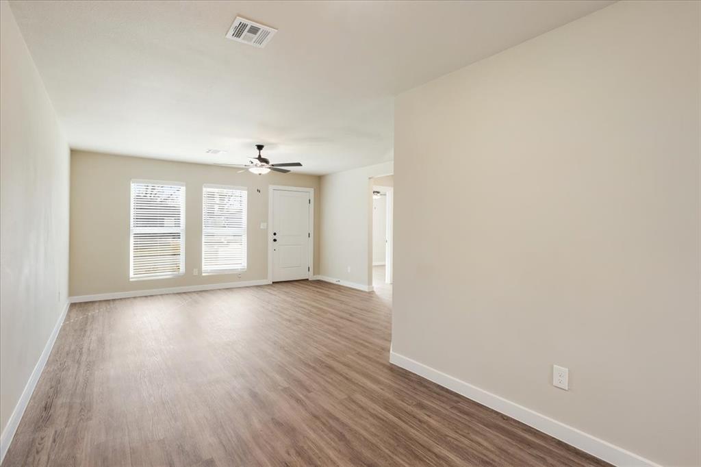 2385 Miller Street Denison, TX 75020 - Photo 7 of 26 wooden floor in an empty room