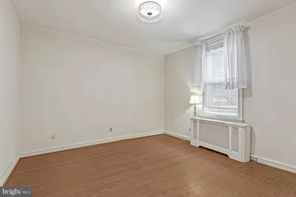 a room with a window and flowerpot