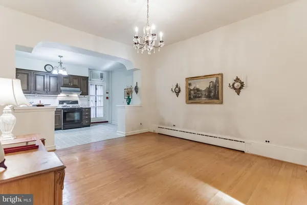 a view of a kitchen with furniture and a chandelier