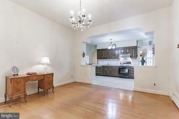 a view of a kitchen with microwave and cabinets