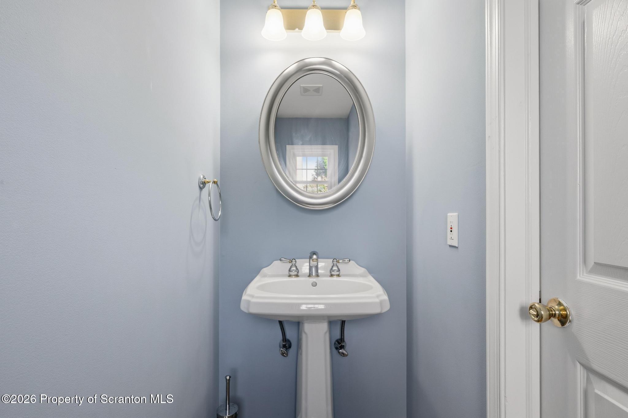 1502 Verne Cl Moosic, PA 18507 - Photo 16 of 46 a bathroom with a sink and a mirror