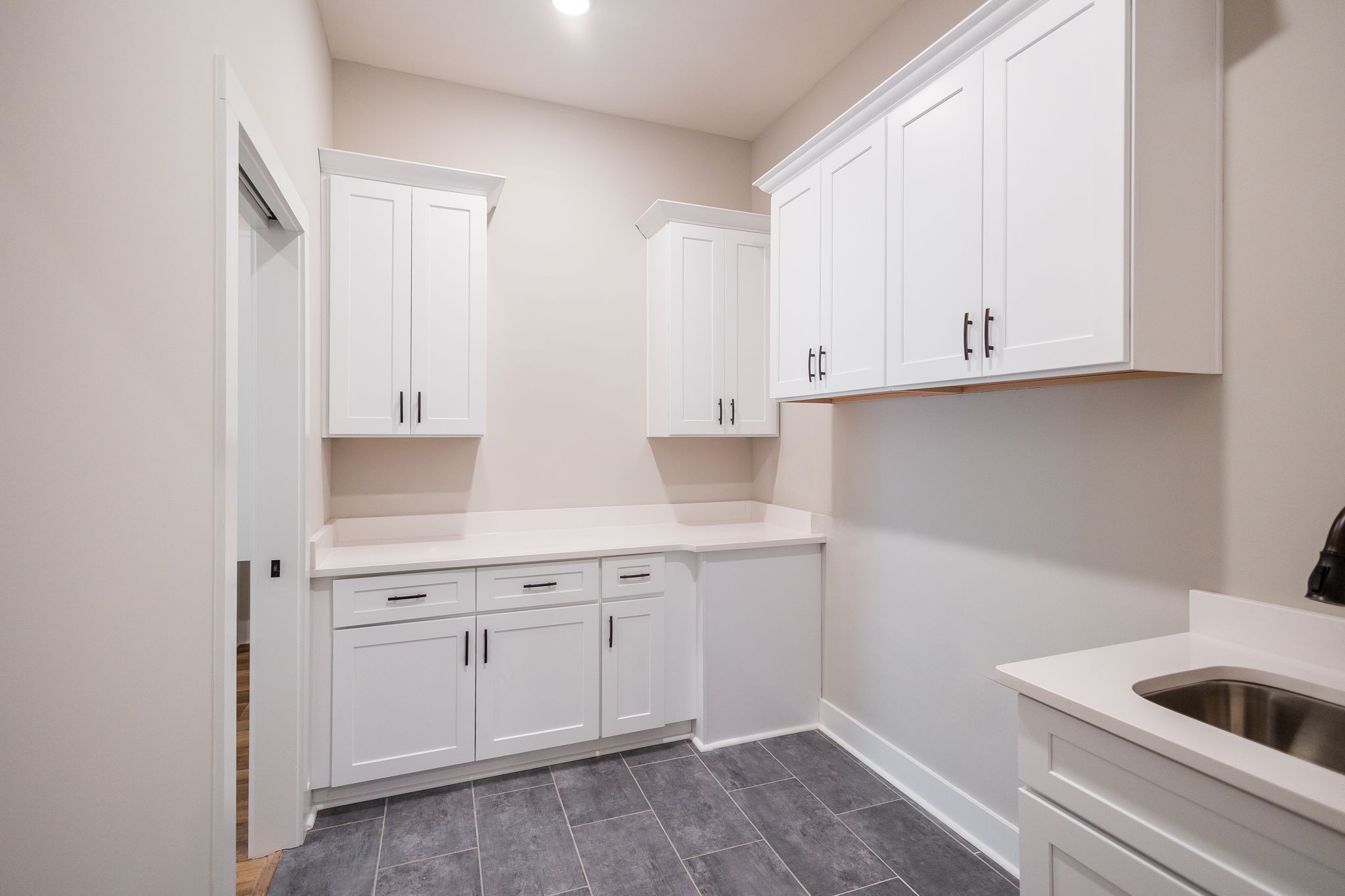 5708 Mullendore Court Murfreesboro, TN 37127 - Photo 30 of 47 a kitchen with white cabinets and sink
