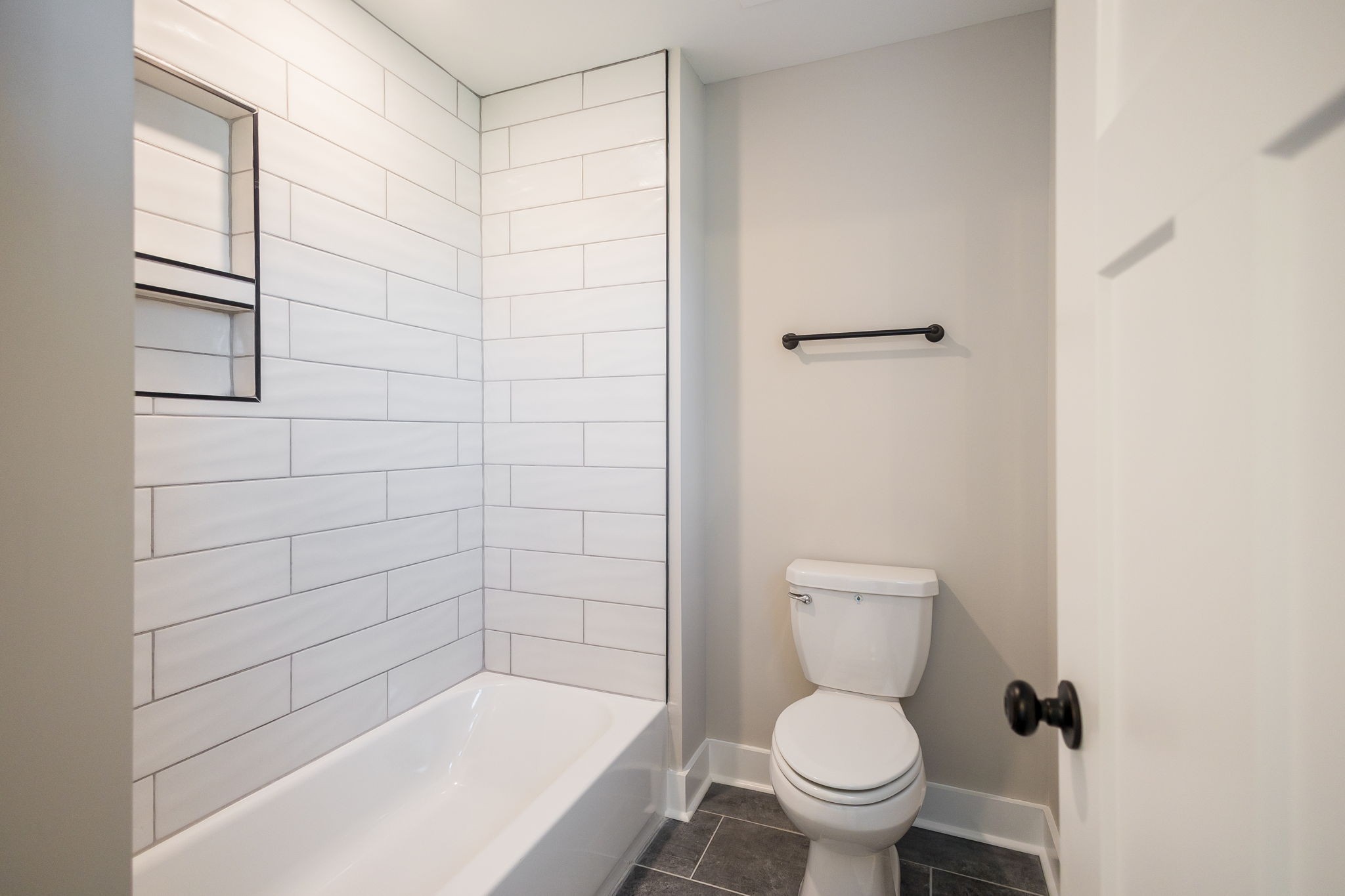 5708 Mullendore Court Murfreesboro, TN 37127 - Photo 37 of 47 a bathroom with a bathtub and a toilet