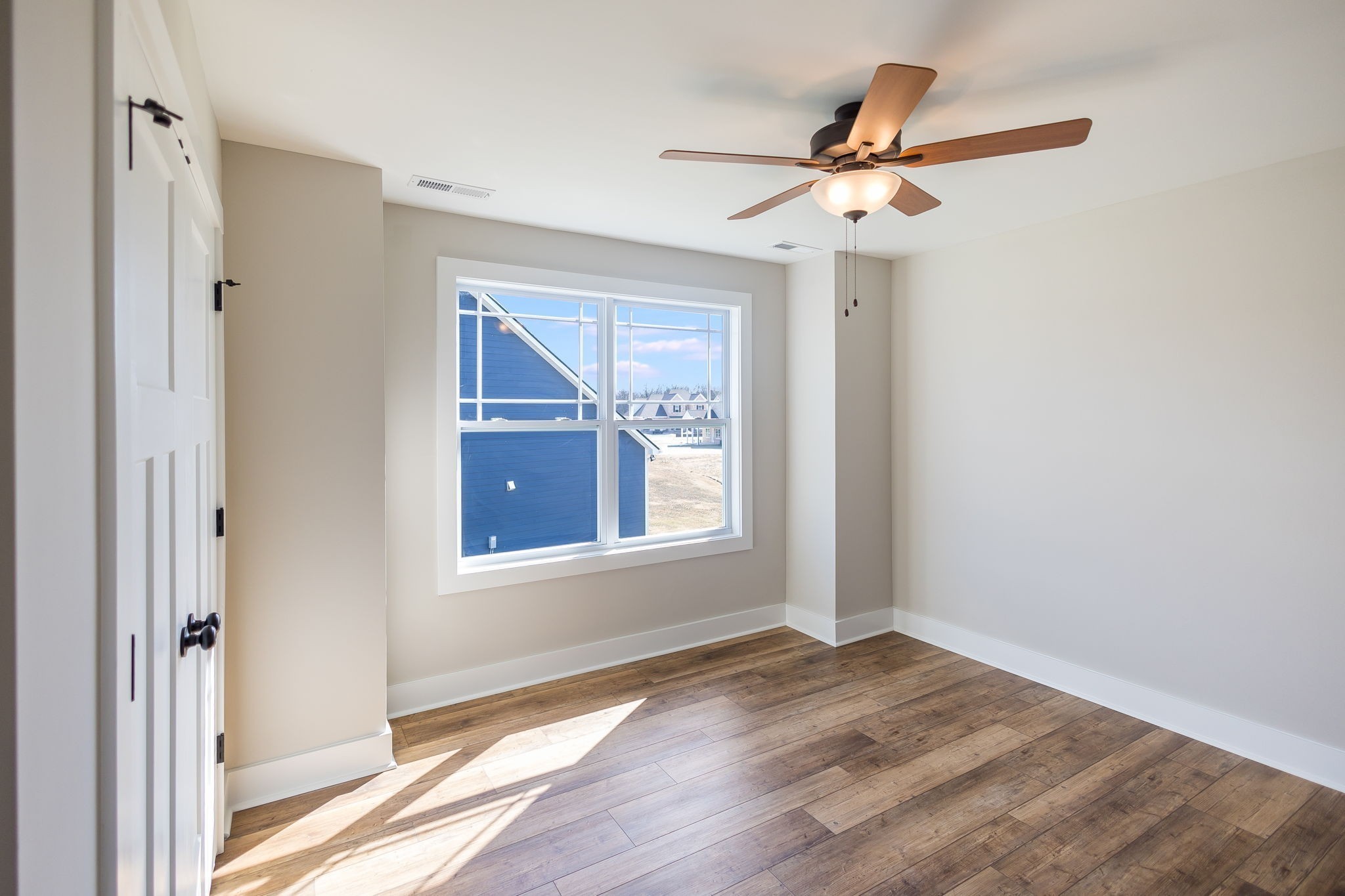 5708 Mullendore Court Murfreesboro, TN 37127 - Photo 39 of 47 an empty room with wooden floor fan and windows