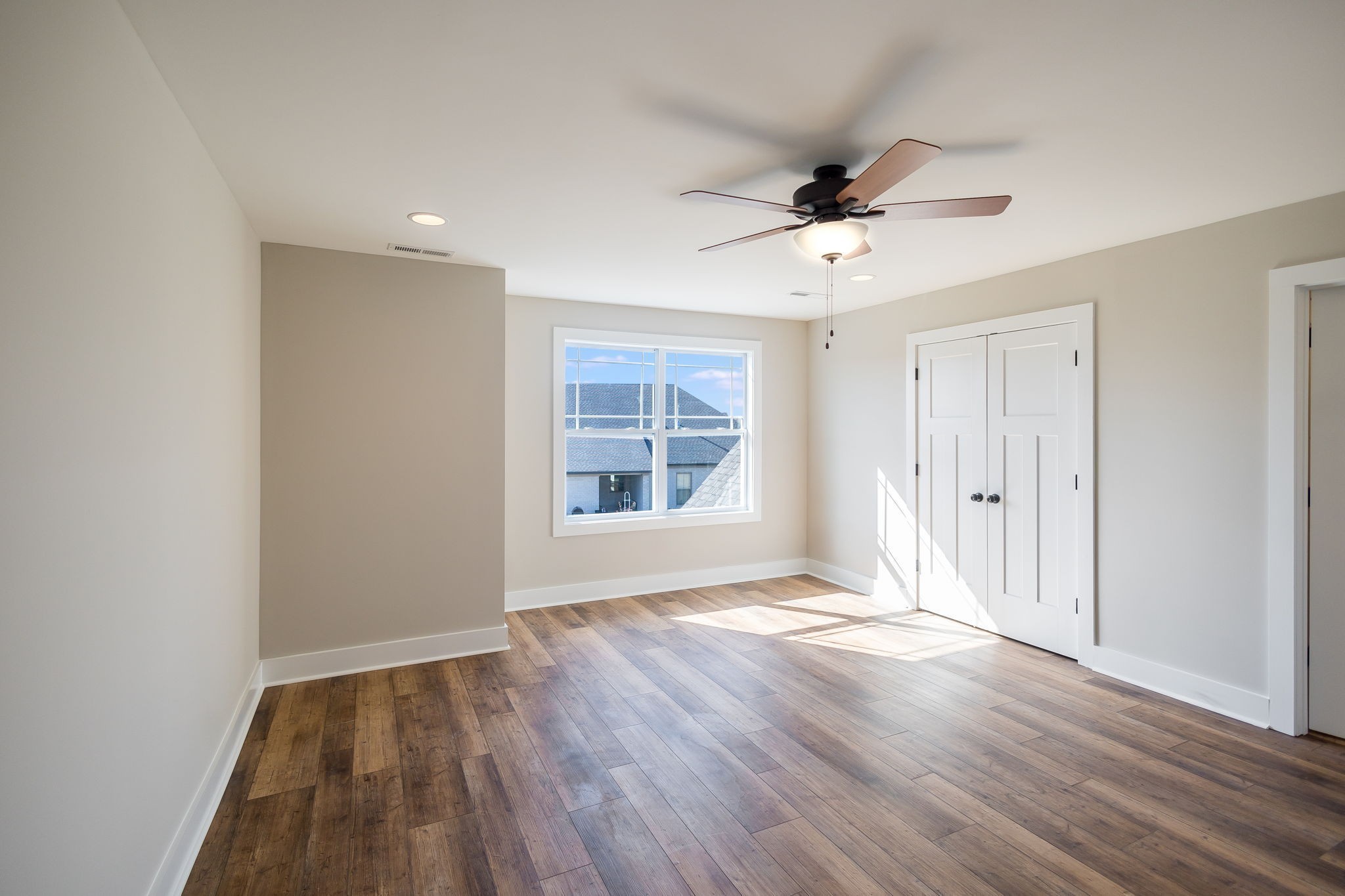 5708 Mullendore Court Murfreesboro, TN 37127 - Photo 40 of 47 a view of an empty room with wooden floor and a window