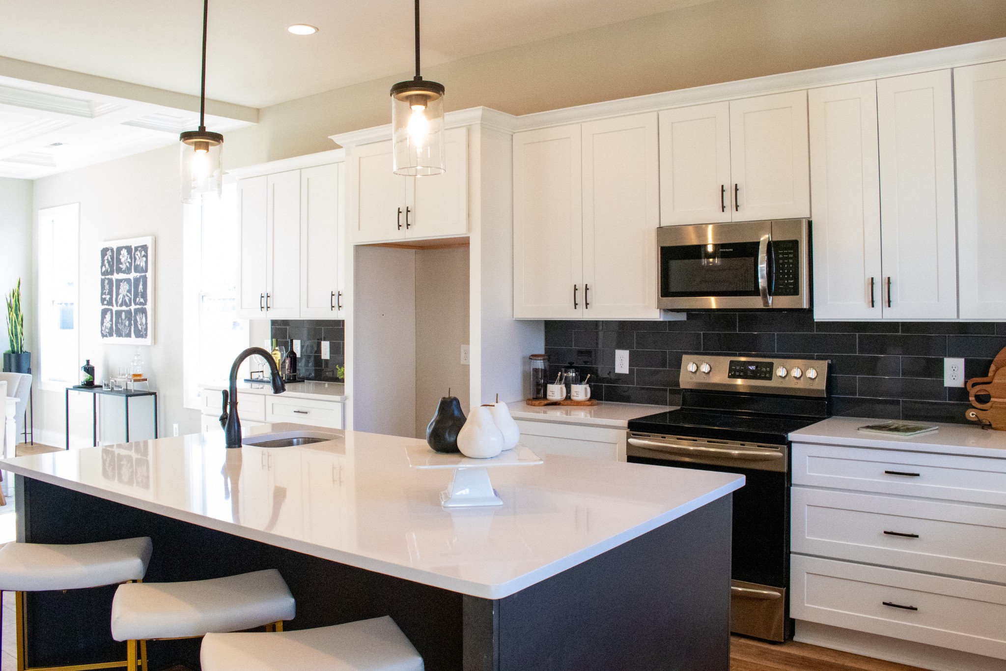 5708 Mullendore Court Murfreesboro, TN 37127 - Photo 5 of 47 a kitchen with kitchen island granite countertop a sink a stove and refrigerator
