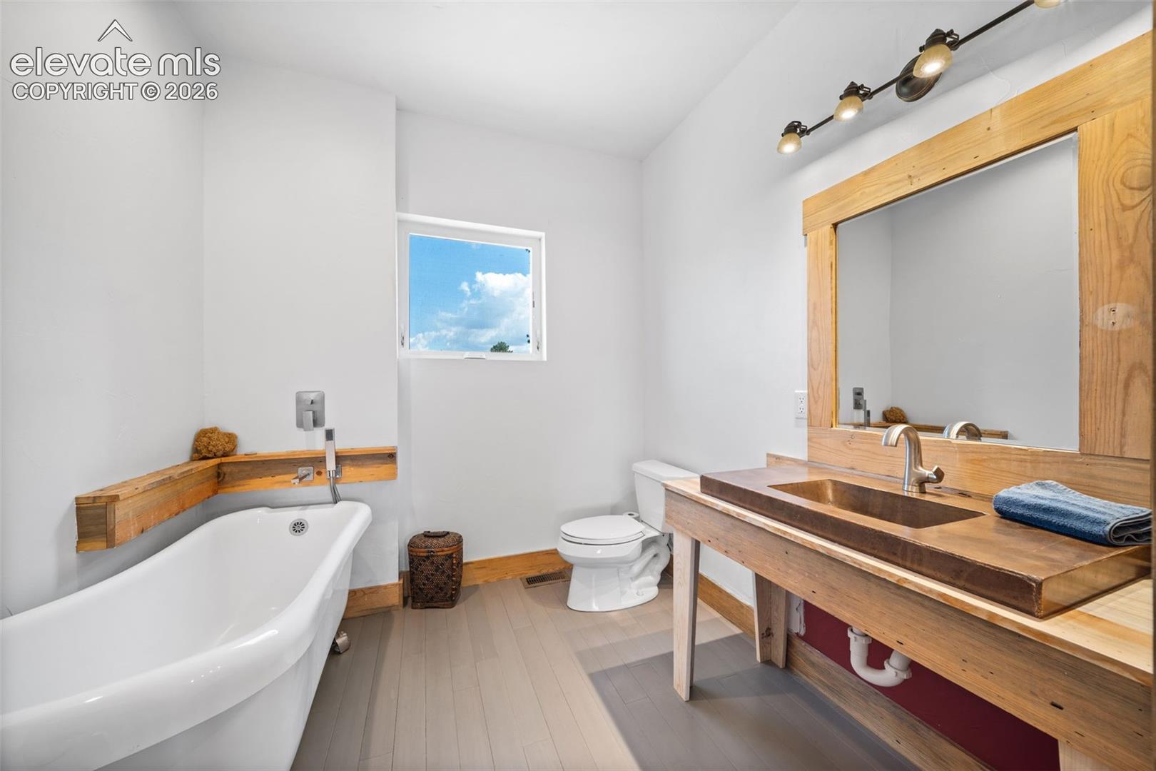 351 High Pasture Road Florissant, CO 80816 - Photo 14 of 42 Main-level bathroom with a freestanding soaking tub.