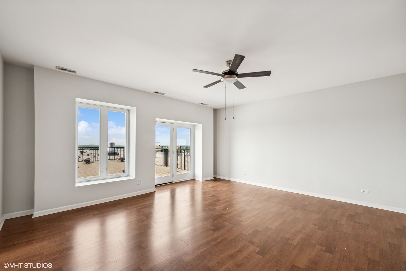 1 Renaissance Place, Unit 4PH Palatine, IL 60067 - Photo 3 of 27 a view of an empty room with a window and wooden floor