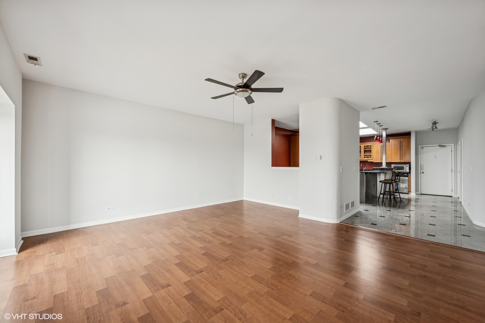 1 Renaissance Place, Unit 4PH Palatine, IL 60067 - Photo 4 of 27 wooden floor in an empty room with a window