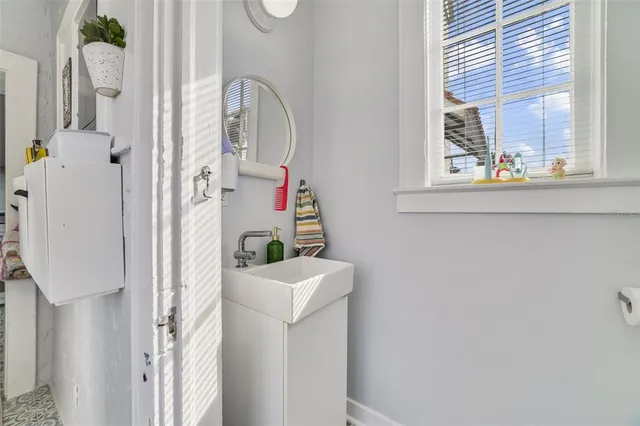a bathroom with a sink and a mirror